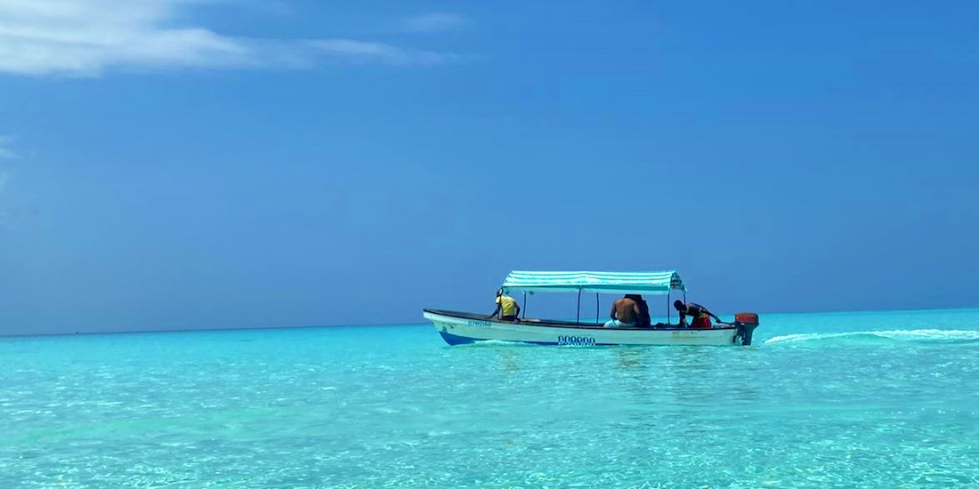 Local boat on the crystal-clear Indian Ocean, Zanzibar