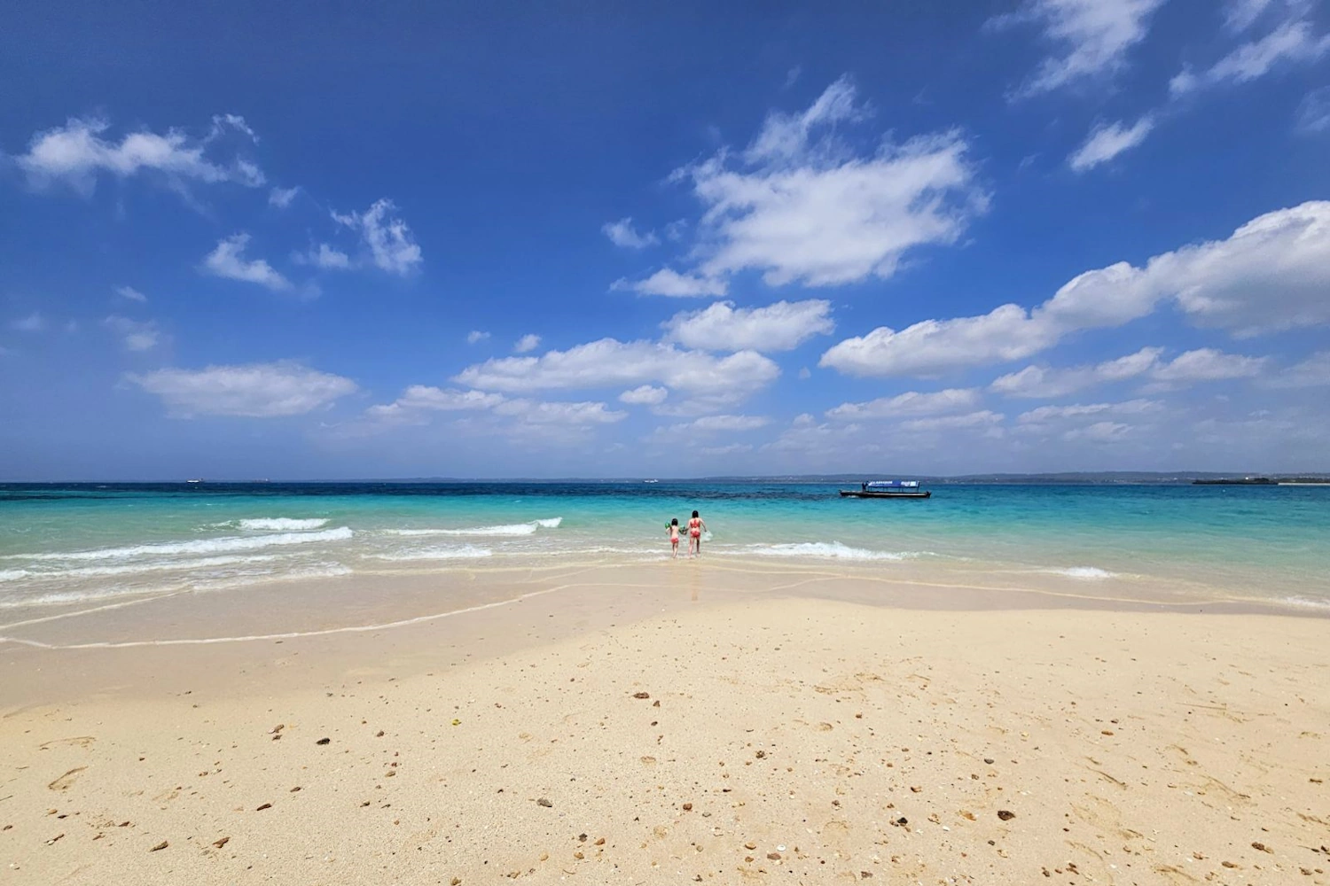 White sand beach and turquoise water on Zanzibar island, Tanzania - the ultimate beach vacation with Pure Afro Travels.
